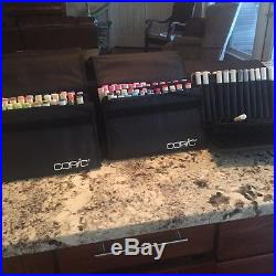 Gently used 155 Copic Markers and 4 Carrying Cases