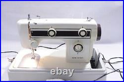 Janome New Home Sewing Machine Model 661 with carrying case