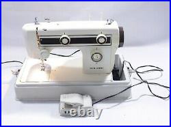 Janome New Home Sewing Machine Model 661 with carrying case