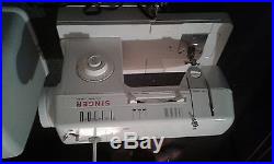 Singer sewing machine model number 3314 c with carrying case and accessories